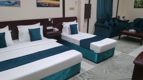 Ένα ή περισσότερα κρεβάτια σε δωμάτιο στο Sadaf Hotel Apartments