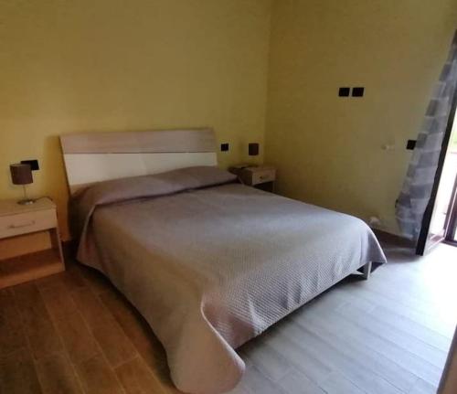 En eller flere senge i et værelse på Il casale dell'artista
