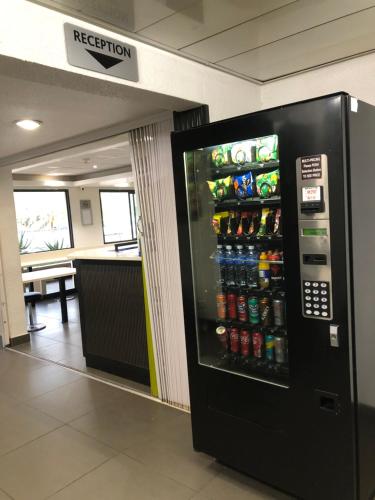 a soda vending machine in an airport terminal at SUN1 Kimberley in Kimberley