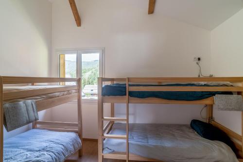 Krevet ili kreveti na sprat u jedinici u okviru objekta Le Chalet Arpennaz