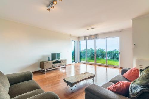 a living room with two couches and a coffee table at Villa Valeriu in Santa Cruz