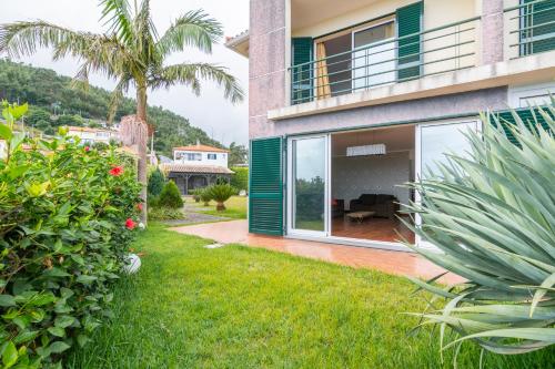a view of a house with a yard at Villa Valeriu in Santa Cruz