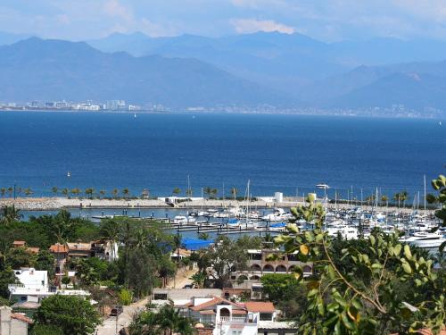 a view of a harbor with boats in the water at Quinta del Encanto in Cruz de Huanacaxtle