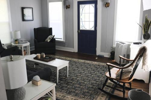 a living room with a blue door at Sweet Mary home in Jamestown