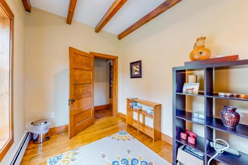a room with a wooden door and a shelf at East Cove in Greenville