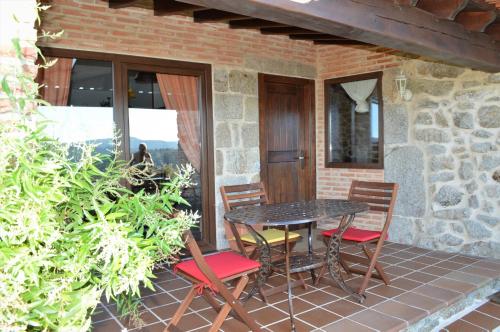 a table and chairs sitting on a patio at Airiños de Mondariz in Mondariz