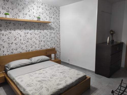 Ένα ή περισσότερα κρεβάτια σε δωμάτιο στο piso acogedor con encanto