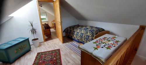 a small bedroom with a bed and a mirror at FERIENHAUS EICK in Friedrichroda