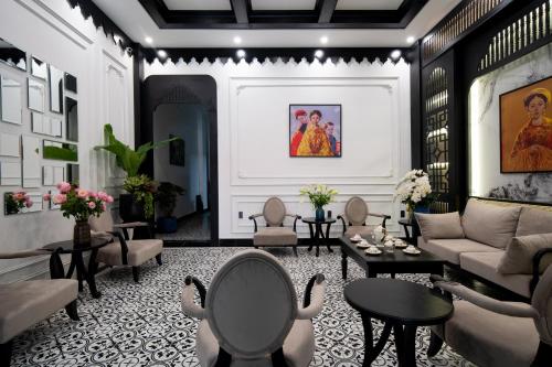 a living room with a couch and a table at Thuy Duong Boutique Hotel Hue in Hue