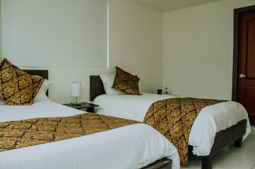 Postel nebo postele na pokoji v ubytování Hotel Parque Reservado