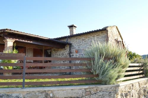 a house with a fence and stairs in front of it at Airiños de Mondariz in Mondariz