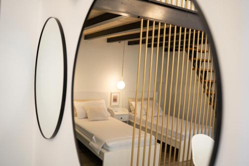 A bed or beds in a room at Blanco - MAGNIFICENT B&B Altamura