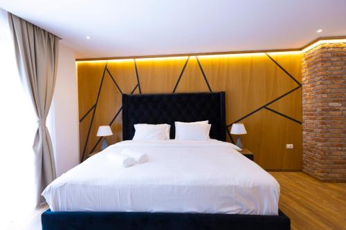 Una cama o camas en una habitación de Hotel Castello