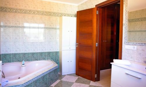 a bathroom with a tub and a sink at 039 Casa Marimar ETV8486 by Mallorca Charme in Muro