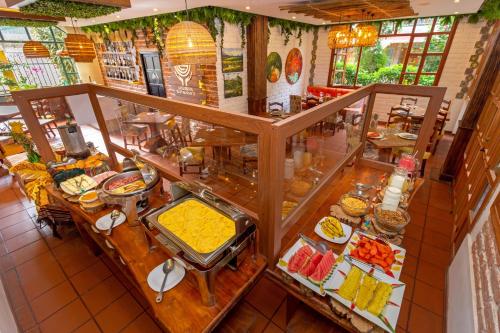 an overhead view of a buffet of food at La Floresta Hotel in Baños