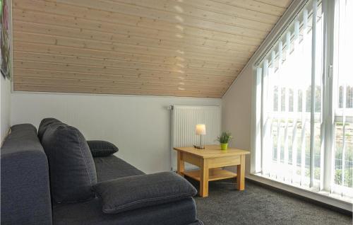 a living room with a couch and a table at Beautiful Home In Nordhorn With Kitchen in Nordhorn
