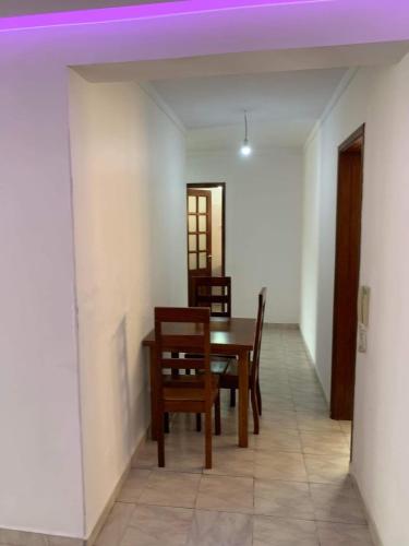 a dining room with a table and chairs at Appart Hotel Belvedere in Praia