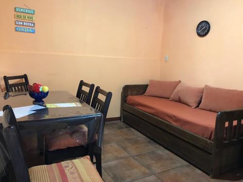 a living room with a couch and a table at Confortable espacio en Minas in Minas