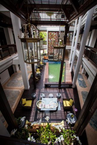 an overhead view of a pool in a resort at Huernnana Boutique Hotel in Phrae
