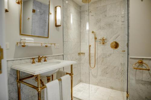 a bathroom with a sink and a shower at Hotel Montevideo - Leading Hotels of the World in Montevideo