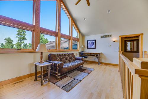 a living room with a couch and some windows at Eagle Crest Nest in Spearfish