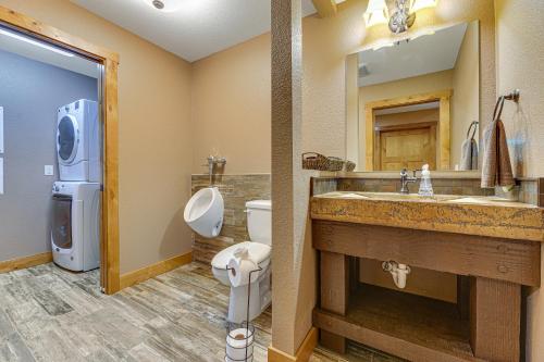 a bathroom with a sink and a toilet and a mirror at Eagle Crest Nest in Spearfish
