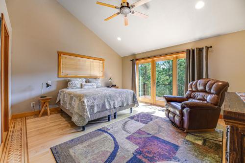 a bedroom with a bed and a chair and a window at Eagle Crest Nest in Spearfish