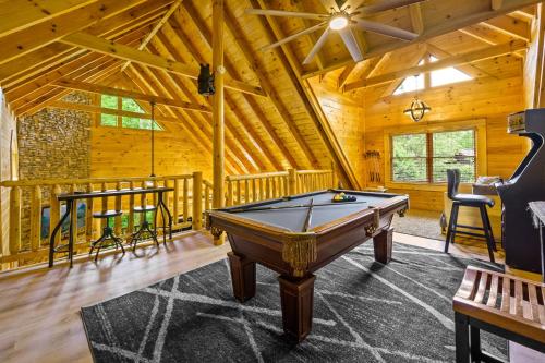 a room with a pool table in a cabin at Enchanted Getaway in Sevierville