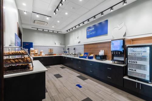 a bakery with a counter with donuts at Holiday Inn Express & Suites Columbia Downtown The Vista by IHG in Columbia