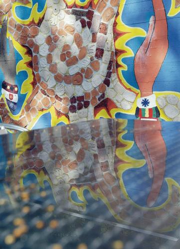 a mosaic picture of a lizard on a table at Youth Hostel Larochette in Larochette