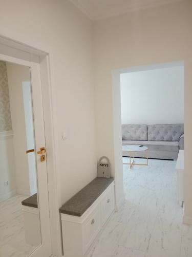 a living room with a couch and a table at Apartament Glamour Chełm in Chełm