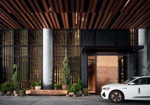 a white car parked in front of a building at 1 Hotel Nashville in Nashville