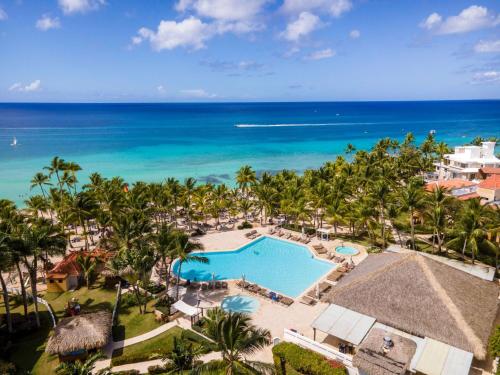 an aerial view of a resort with a pool and the ocean at Viva Dominicus Palace by Wyndham, A Trademark All Inclusive in Bayahibe