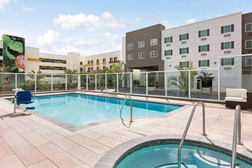 a swimming pool in the middle of a building at Wyndham Anaheim in Anaheim