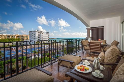 a balcony with a view of the ocean at Grand Residences Riviera Cancun, All Inclusive in Puerto Morelos