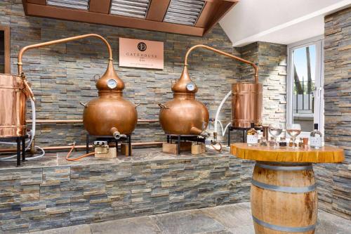 a room with two large copper pots on a wall at Wyndham Duchally Country Estate in Auchterarder