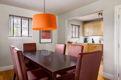 a kitchen and dining room with a table and chairs at Wyndham Duchally Country Estate in Auchterarder