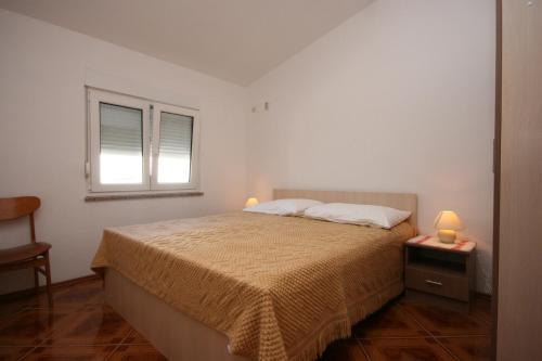 מיטה או מיטות בחדר ב-Double Room Pag 6311b