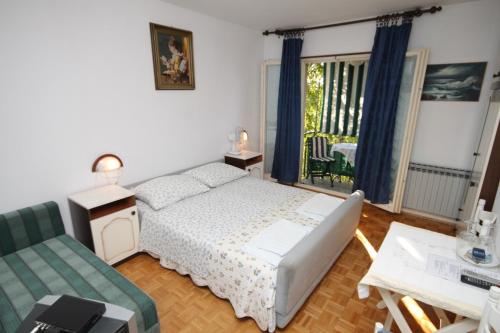 Postel nebo postele na pokoji v ubytování Apartments and rooms with parking space Rovinj - 7170