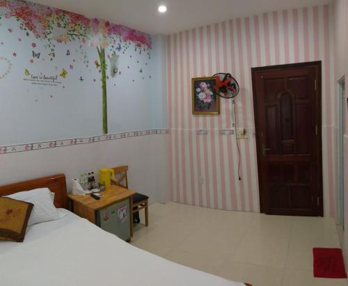 Ein Bett oder Betten in einem Zimmer der Unterkunft Ngan Giang Guesthouse