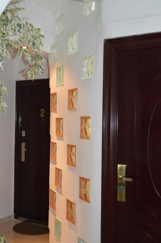 a room with a wall with pictures on the wall at Apartments Ohrid Lake in Ohrid
