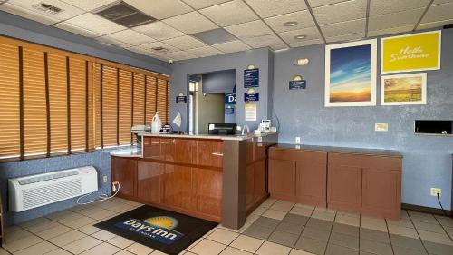 a waiting room with a reception desk in a hospital at Days Inn by Wyndham Salina South in Salina