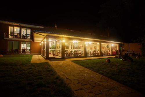a building lit up at night with lights at Casa Andina Premium Puno in Puno