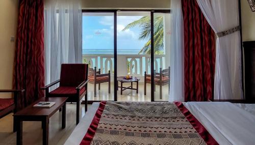 Postel nebo postele na pokoji v ubytování PrideInn Paradise Beach Resort & Spa Mombasa