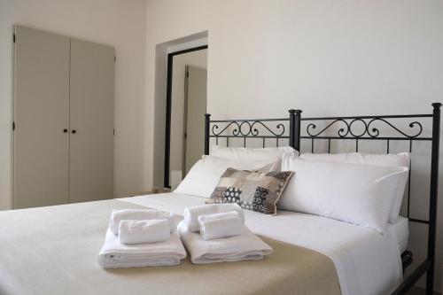 Villa Demarino tesisinde bir odada yatak veya yataklar