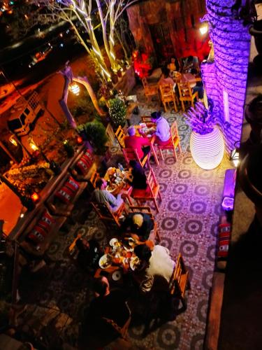 an overhead view of a restaurant with people sitting at tables at Petra Desert Dream Hotel in Wadi Musa