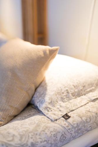 a pillow sitting on top of a bed at Kajkanten Restaurang B&B in Köpmanholmen