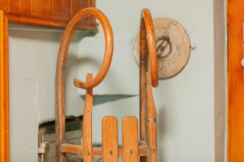 a pair of wooden skis hanging on a wall at The Farmhouse in Sedrun