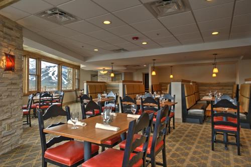 a dining room with tables, chairs, and tables at The Lodge at Breckenridge in Breckenridge