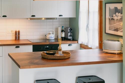 a kitchen with a counter top with a basket on it at The Farmhouse in Sedrun